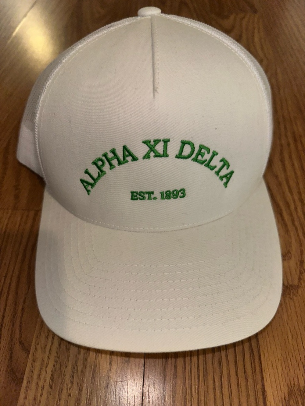The Classic White Mesh Trucker Hat with Gold Label